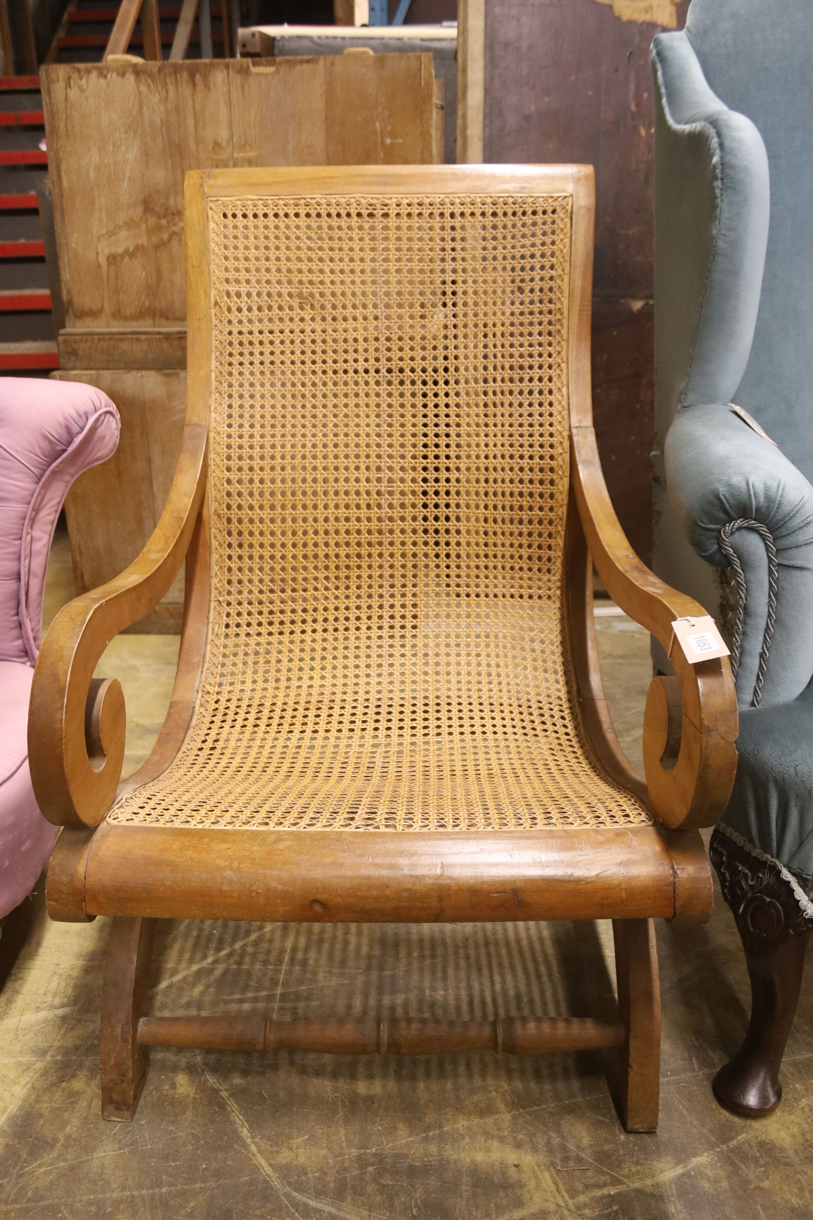 A caned hardwood plantation chair, width 59cm, depth 86cm, height 98cm